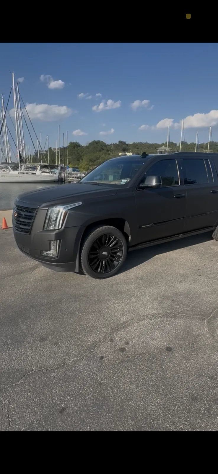 Cadillac Escalade luxury SUV front three-quarter exterior in Austin