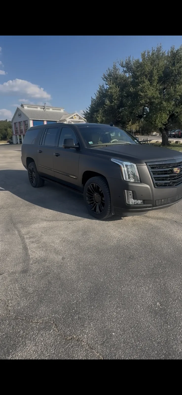 Cadillac Escalade front side profile luxury SUV rental in Austin