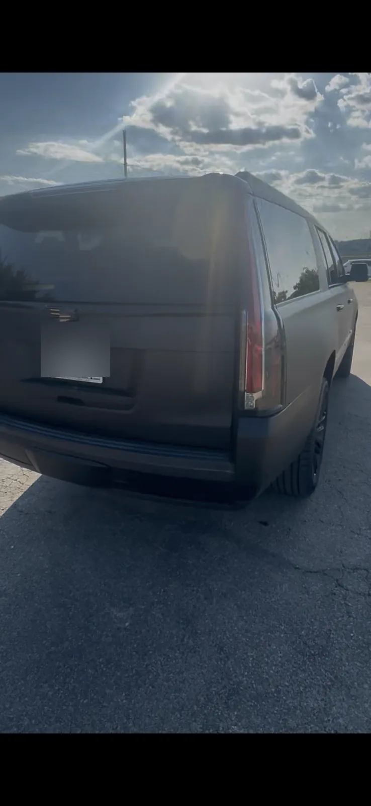 Cadillac Escalade rear exterior detail with license plate obscured