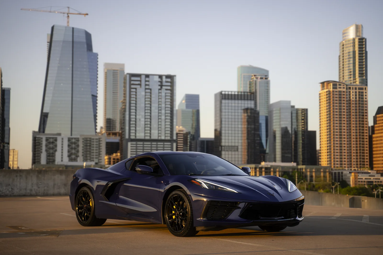 Hysteria Purple Corvette side profile with Austin skyline